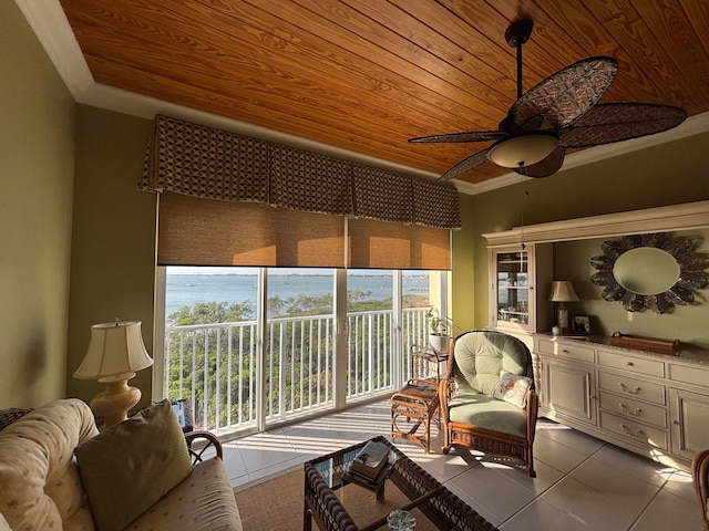 sunroom with a water view, ceiling fan, and wood ceiling