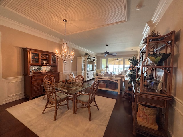 dining area with ceiling fan with notable chandelier and ornamental molding