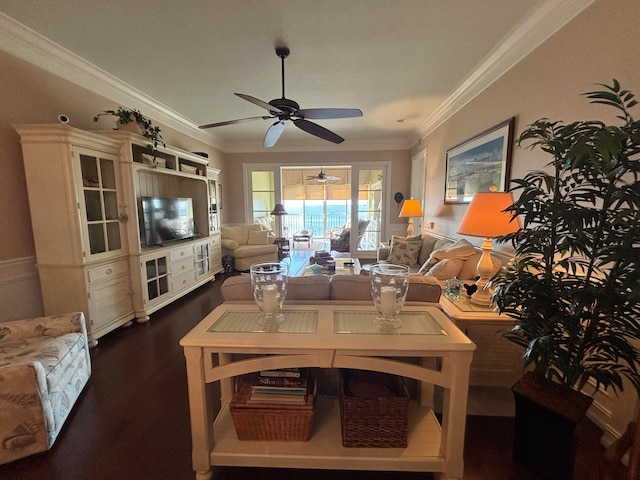 living room featuring dark wood-type flooring, ceiling fan, and ornamental molding