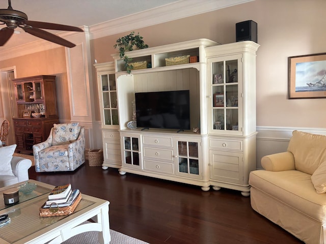 living room with ceiling fan, dark hardwood / wood-style flooring, and crown molding