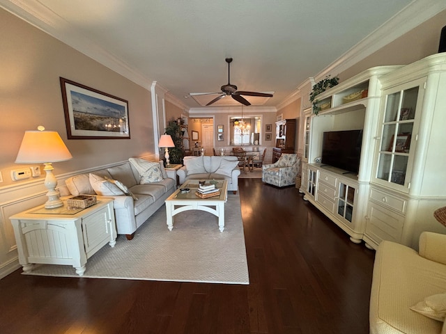 living room with hardwood / wood-style floors, ceiling fan, and crown molding