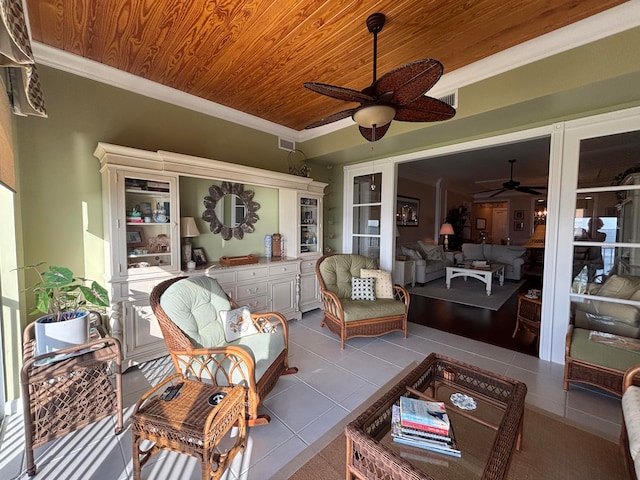 sunroom / solarium with ceiling fan and wooden ceiling