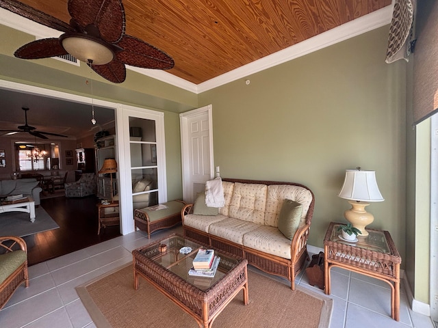 living room featuring ceiling fan, light hardwood / wood-style floors, ornamental molding, and wooden ceiling