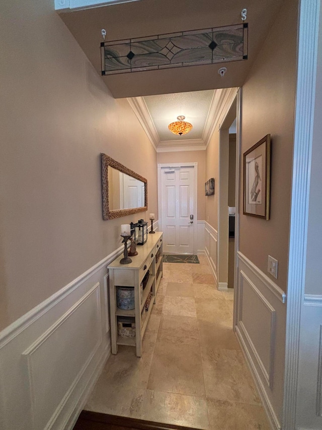 doorway featuring crown molding