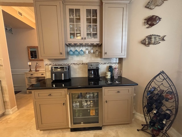 bar featuring tasteful backsplash and wine cooler