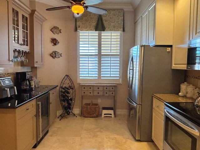 kitchen with appliances with stainless steel finishes, ceiling fan, crown molding, dark stone countertops, and wine cooler