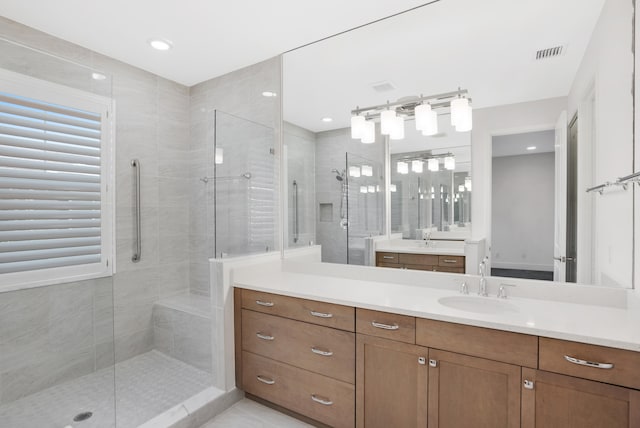 bathroom with vanity and an enclosed shower