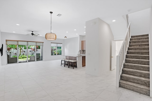 living room with ceiling fan