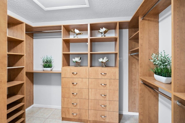 walk in closet featuring light tile patterned floors