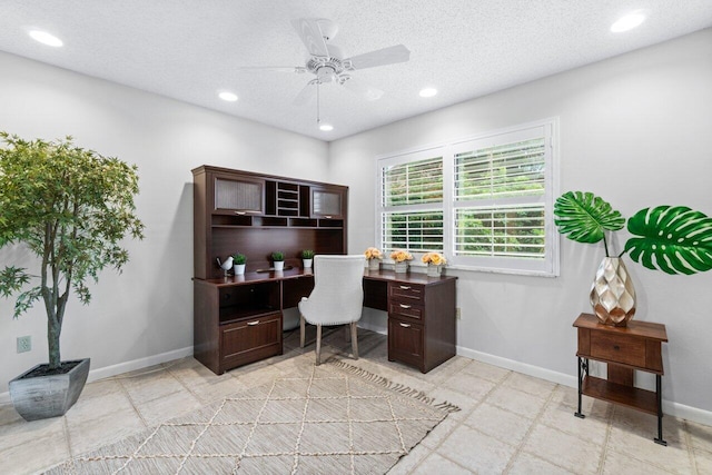 office area featuring a textured ceiling and ceiling fan