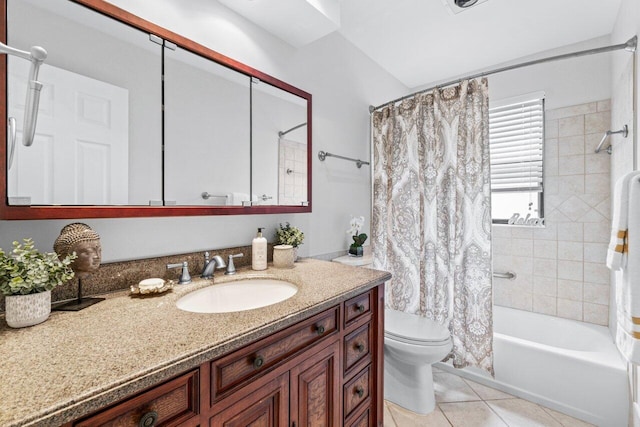 full bathroom featuring tile patterned flooring, vanity, toilet, and shower / bath combo with shower curtain