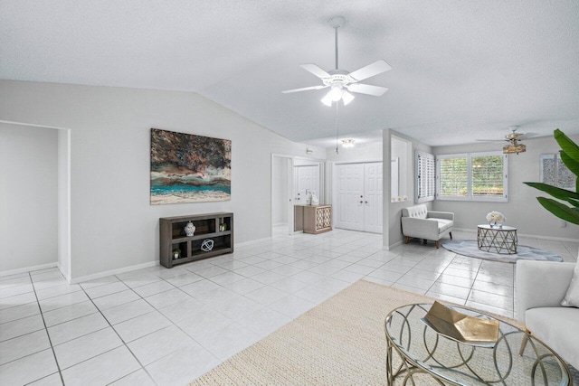 tiled living room with vaulted ceiling and ceiling fan