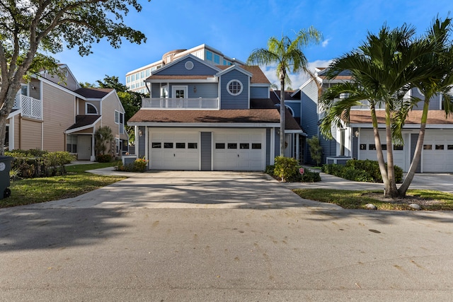 view of front of home featuring a balcony and a garage