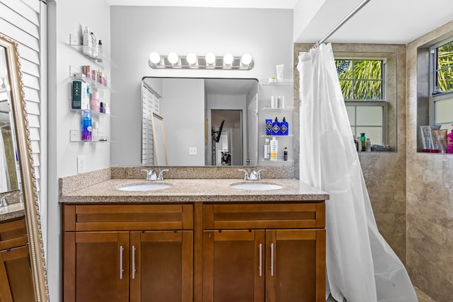 bathroom with vanity and walk in shower