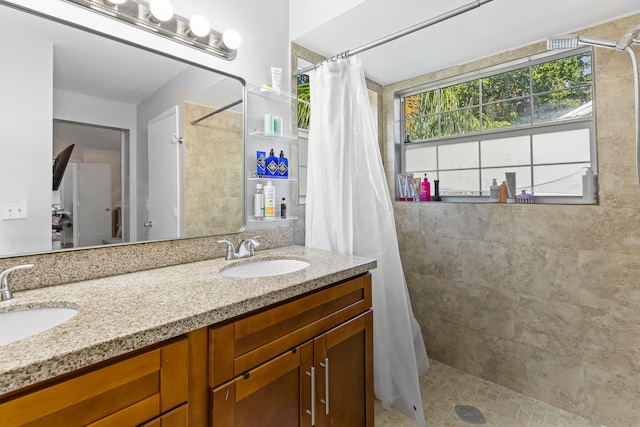 bathroom with a shower with curtain and vanity