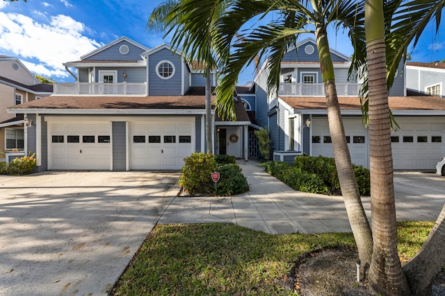 view of front of home with a balcony and a garage