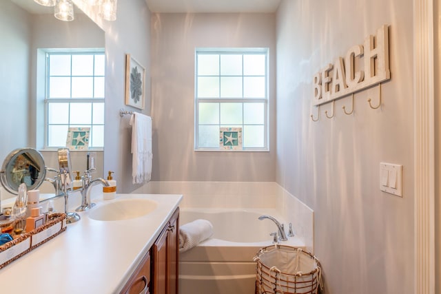 bathroom with a bath and vanity