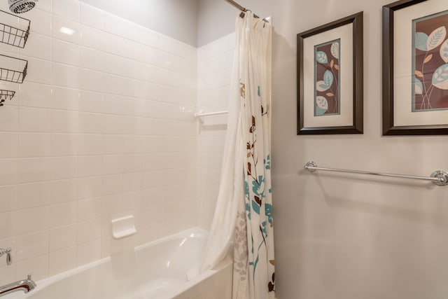 bathroom featuring shower / bath combo with shower curtain