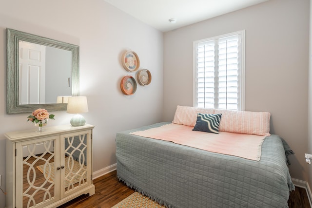 bedroom featuring dark hardwood / wood-style flooring