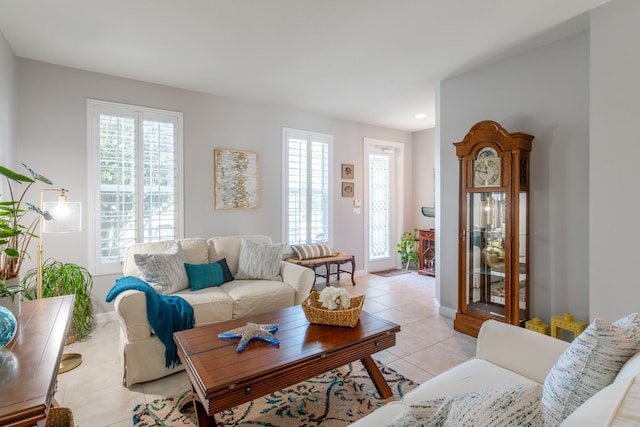 living room with light tile patterned flooring and a wealth of natural light