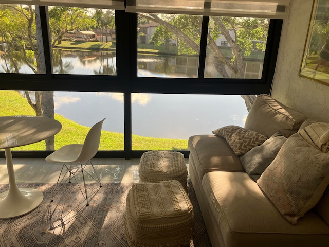 sunroom / solarium with a water view