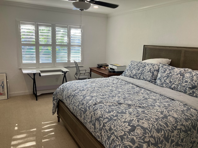 bedroom with light carpet, ceiling fan, and ornamental molding