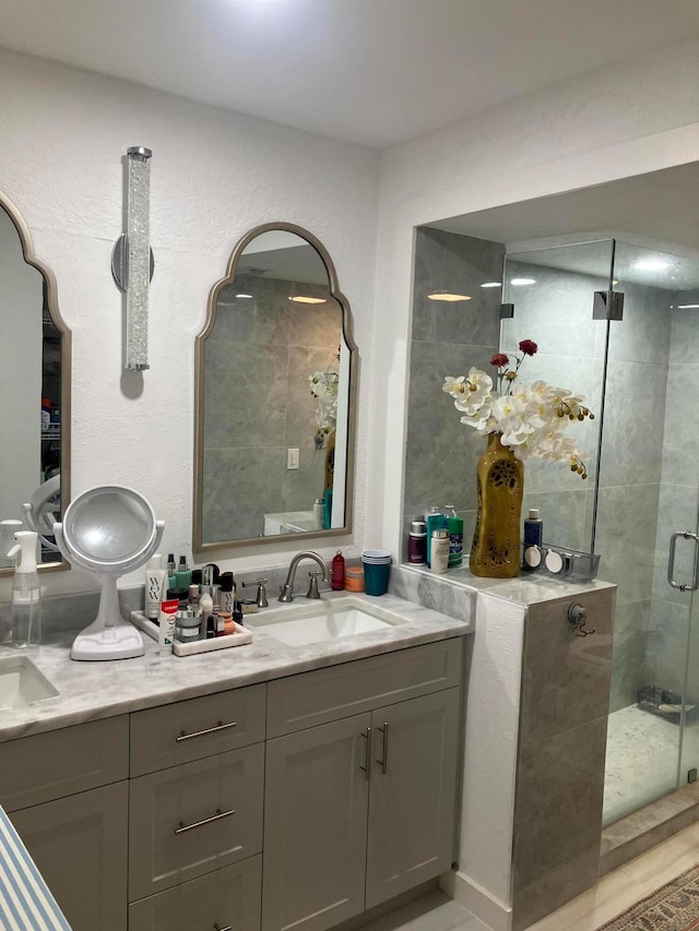 bathroom with vanity and walk in shower