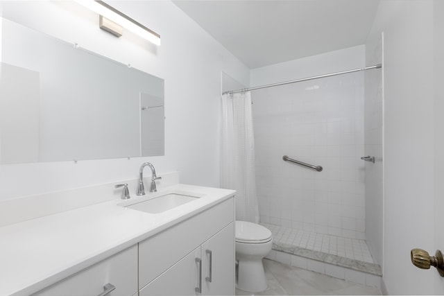 bathroom with vanity, toilet, and walk in shower