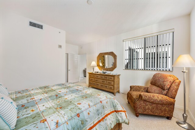 bedroom featuring light colored carpet