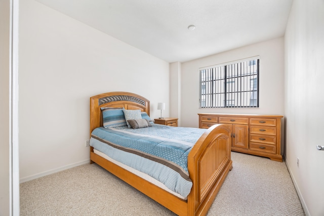 bedroom with light colored carpet