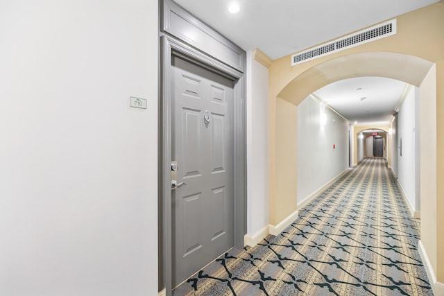 corridor featuring ornamental molding