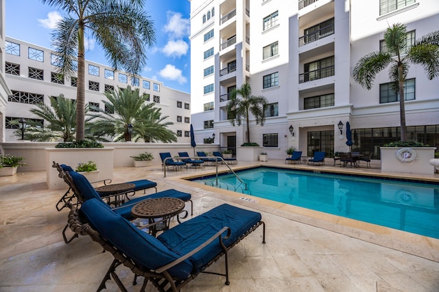 view of swimming pool with a patio area