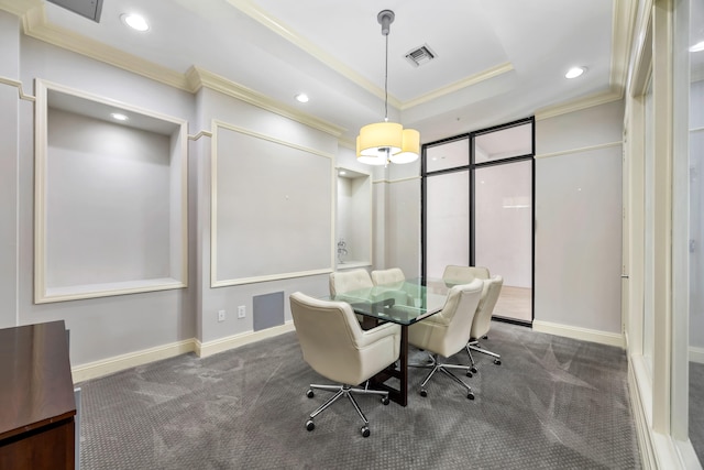 dining room featuring dark carpet and ornamental molding