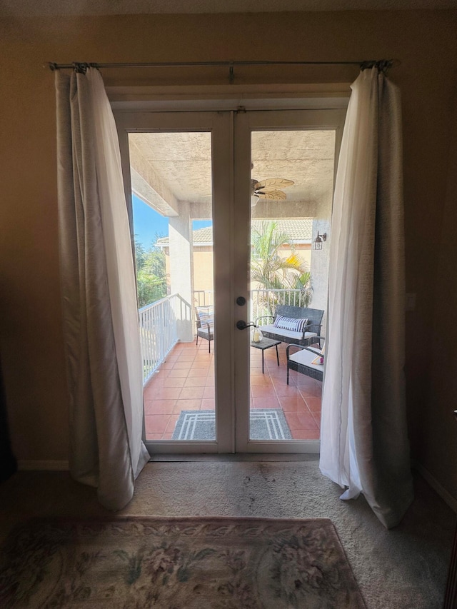 entryway with carpet and french doors