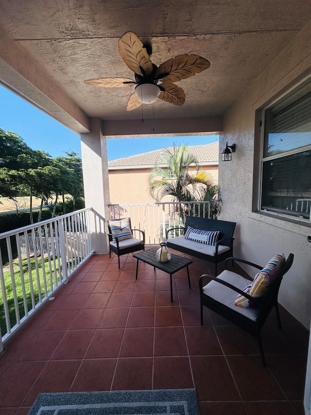 view of patio / terrace featuring a balcony and ceiling fan