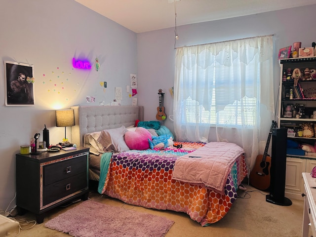 bedroom featuring light colored carpet