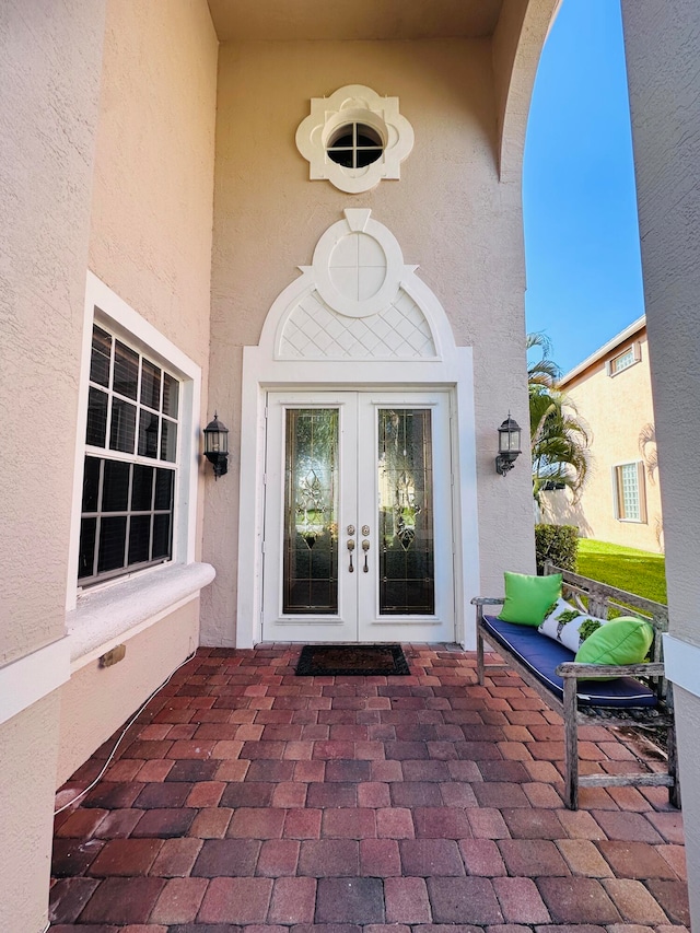 doorway to property with a patio area and french doors