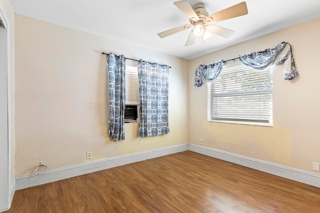 empty room featuring ceiling fan and hardwood / wood-style floors