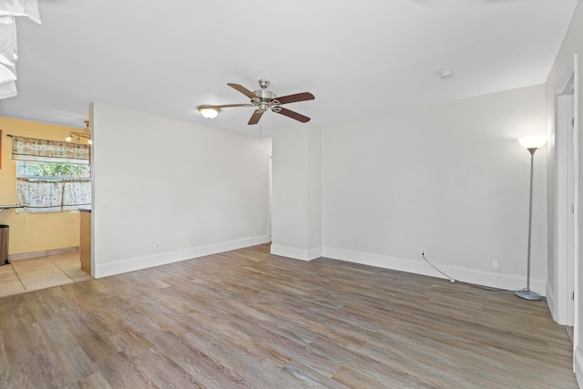 unfurnished room featuring hardwood / wood-style flooring and ceiling fan