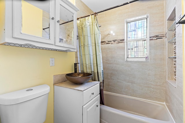 full bathroom with shower / bath combination with curtain, vanity, and toilet