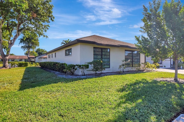 view of home's exterior featuring a yard