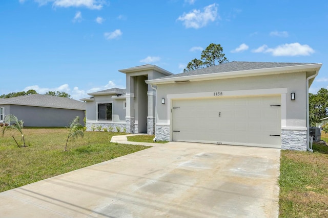 prairie-style house featuring a garage and a front lawn