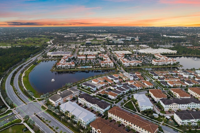 aerial view at dusk with a water view