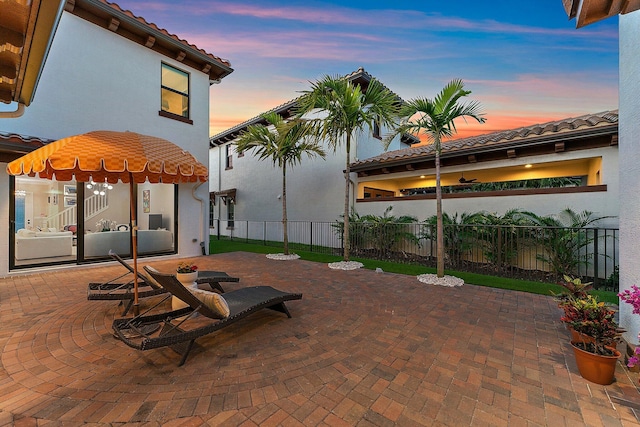 view of patio terrace at dusk