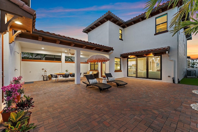 patio terrace at dusk with ceiling fan