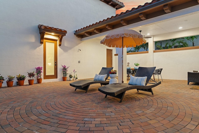 view of patio terrace at dusk