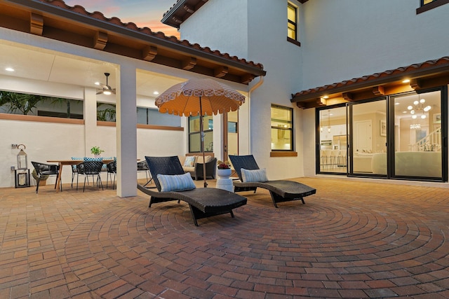 view of patio terrace at dusk