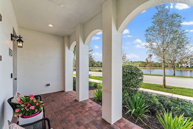 view of patio featuring a water view