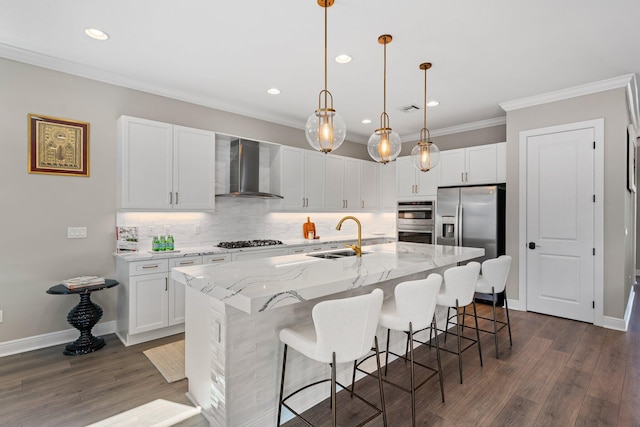 kitchen with white cabinetry, sink, wall chimney exhaust hood, dark hardwood / wood-style flooring, and an island with sink