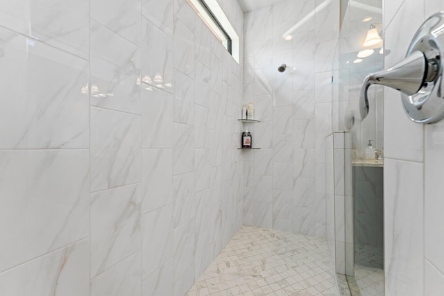 bathroom with tiled shower